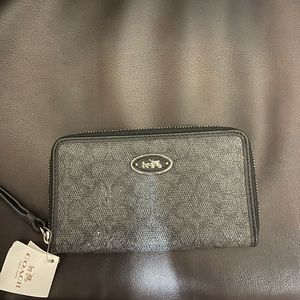 Coach black wristlet with tags-small flaw